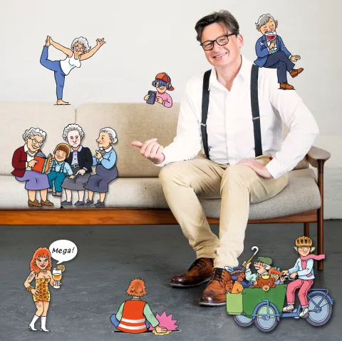 Foto Verhasselt Stefan Verhasselt posiert auf einem Sofa